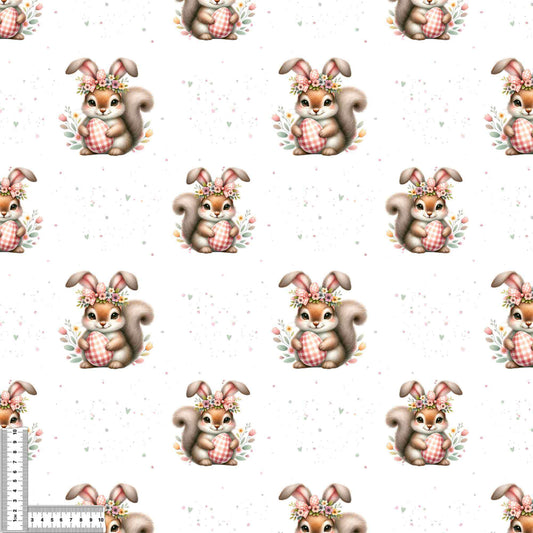 Detailaufnahme vom Jersey Stoff mit Osterhörnchen und floralen Details auf hellem Hintergrund, perfekt für kreative Nähprojekte