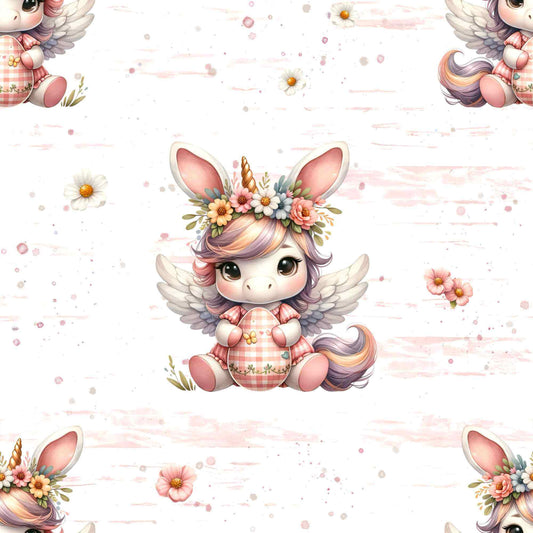 Detailaufnahme vom Osterstoff auf French Terry oder Jersey mit Oster Einhorn und floralen Details auf hellem Hintergrund, perfekt für kreative Nähprojekte